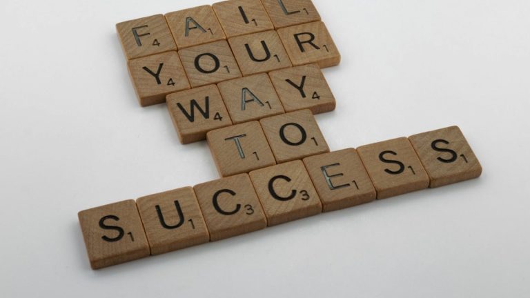 scrabble, scrabble pieces, lettering, letters, wood, scrabble tiles, white background, words, quote, fail your way to success, persevere, don't give up, try again, get up, move on, keep innovating,